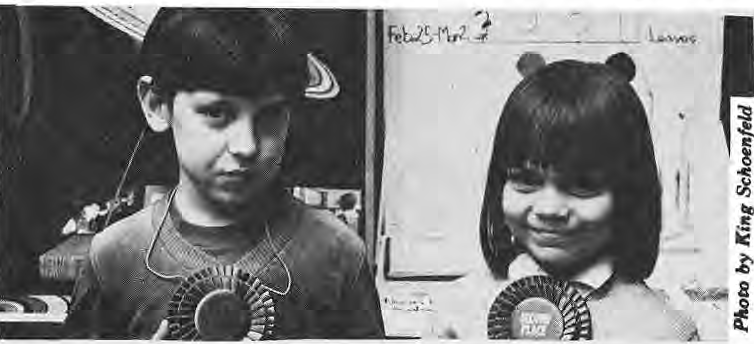 Jeremy Schoenfeld and Jessica Sindel displaying science-fair ribbons.