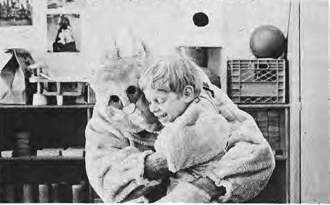 Child hugging the Easter Bunny at Stella Maris.