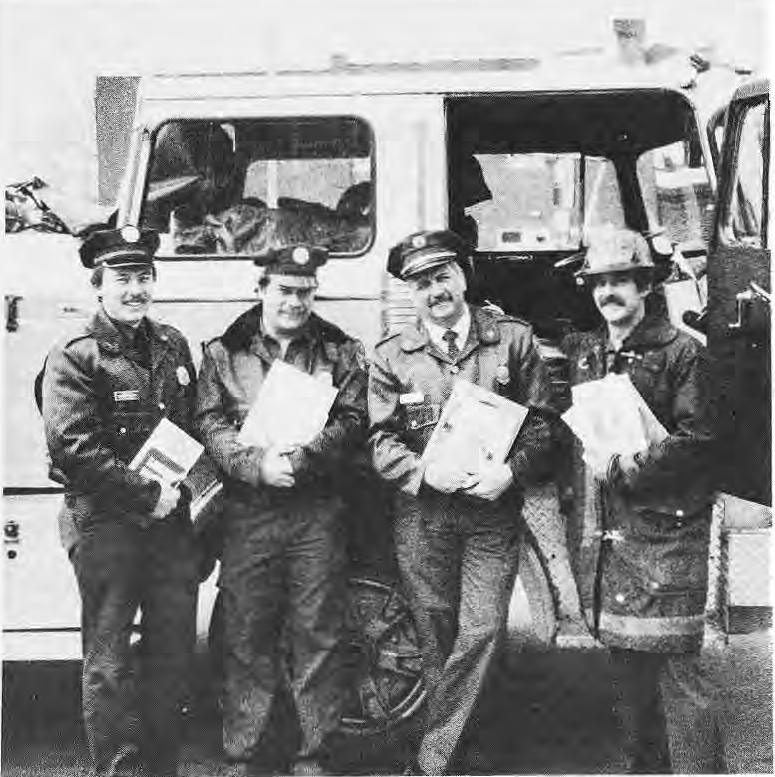 Edward Meyer, Lewis Hill, Don Pikesly and Dave Crawford with library books.