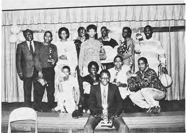 Delmar Baptist basketball team with trophies.