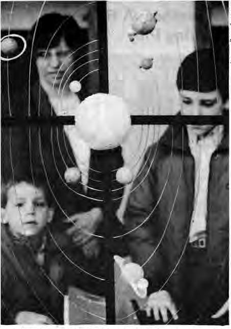 Schoenfeld family viewing a school science project.