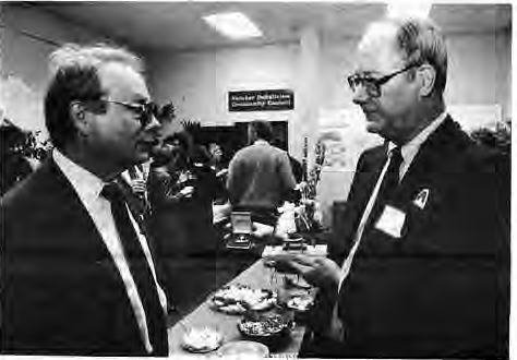 Sam Green(left)looks at Arch memorabilia collected by Art Santen. Photo by King Schoenfeld.