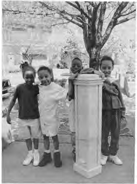 Andy Cross’s barricade posts. Kids(from left)playing in the area were Melissa Quinn, Edmund Quinn, Dwayne “DJ” Hagens, Ebony Quinn. Photographer not credited.