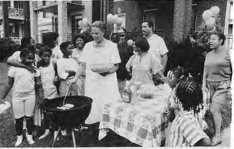 Families gather at a neighborhood cookout. Photo by King Schoenfeld.