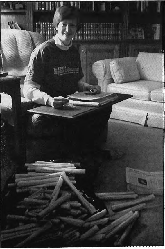 Sue Rothschild prepares newspapers for delivery. Photographer not credited.