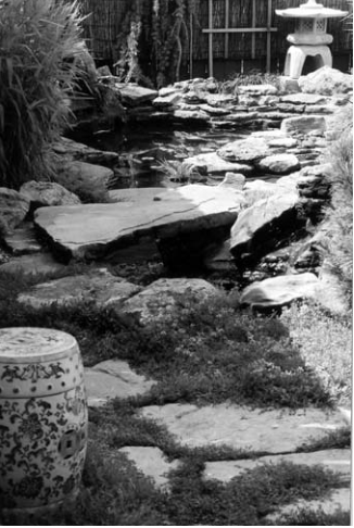 Garden water feature illustrating tour announcement. Photographer not credited.