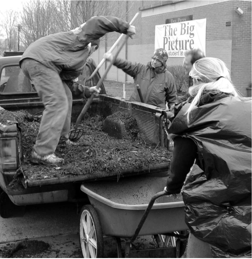 17 high school students and four adult volunteers from First Presbyterian Church Urban Mission, Ames and Boone, Iowa, help build the Big Picture School garden March 19 under the guidance of the Beautification Committee and Andy Cross.