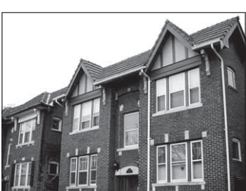 Rehabilitated Washington Avenue housing used to illustrate conversion from multiple units to fewer households. Descriptive caption supplied.