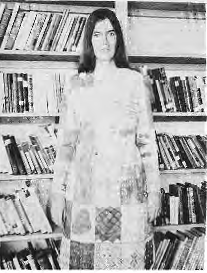 Teacher Debbie Williams modelling fabric decorated by her fifth-grade students at St. Roch’s.