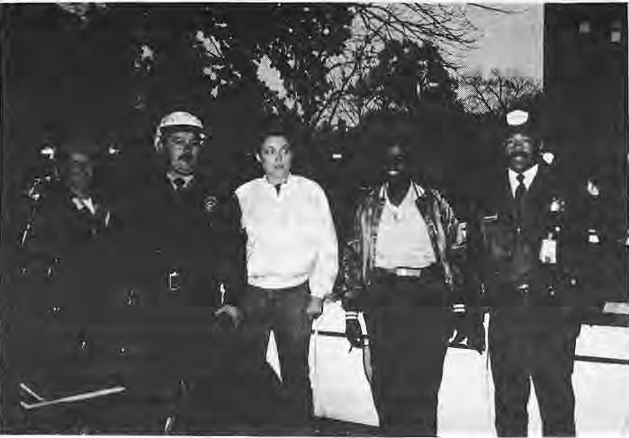 Ottie Edwards with volunteers and Wells Fargo officers on Halloween patrol.