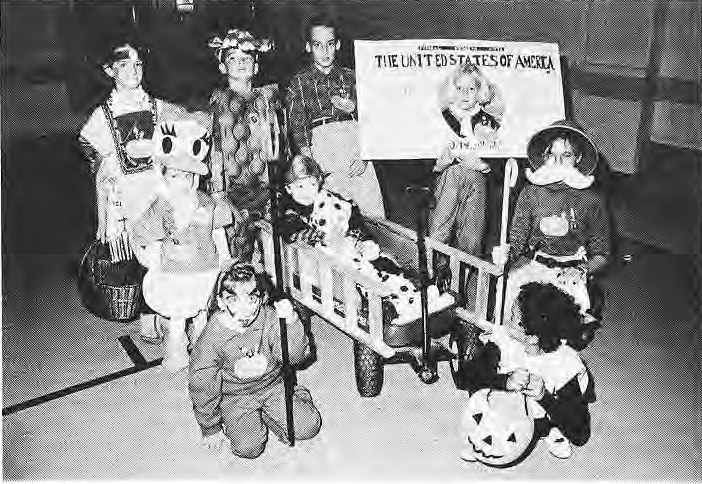 Children wearing prize-winning costumes at the Rosedale Halloween party.