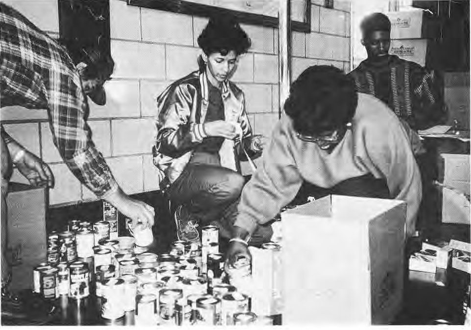 Explorer Post volunteers sorting donated canned food.