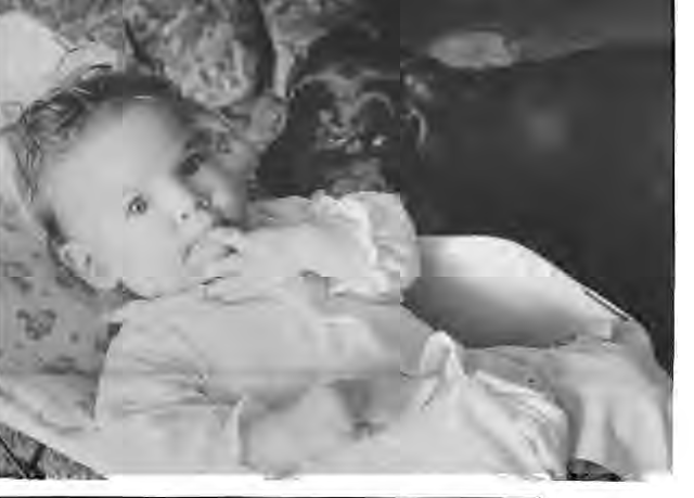 Child with a pet illustrating the original Pet Talk column. Names and photographer not credited.