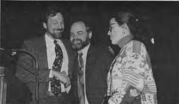 Frank Hamsher congratulating Tom and Karleen Hoerr on the dedication of the playground. Photographer not credited.