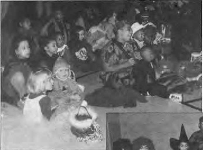 Children enjoy Joe the Juggler from Everyday Circus. Photographer not credited.