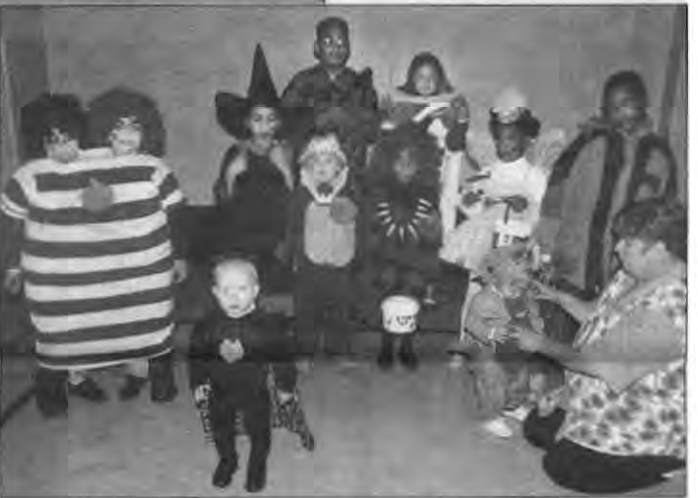 Halloween costume contest participants. Photographer not credited.