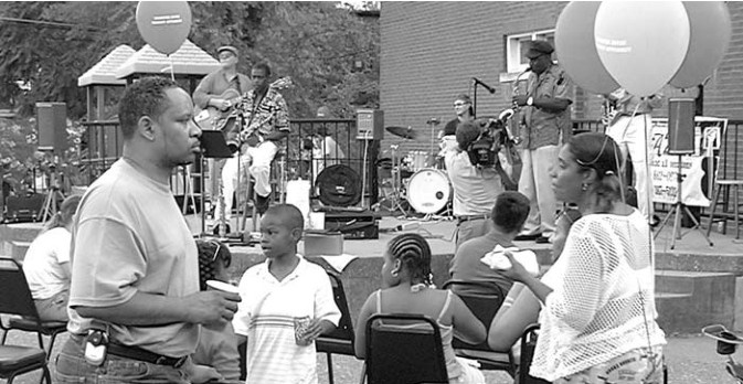 Band and neighbors celebrate. Photographer not credited.