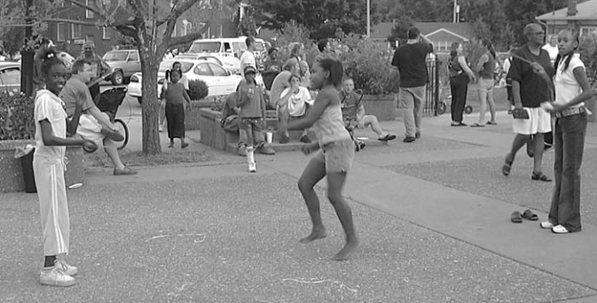 Children jump rope at National Night Out. Photographer not credited.