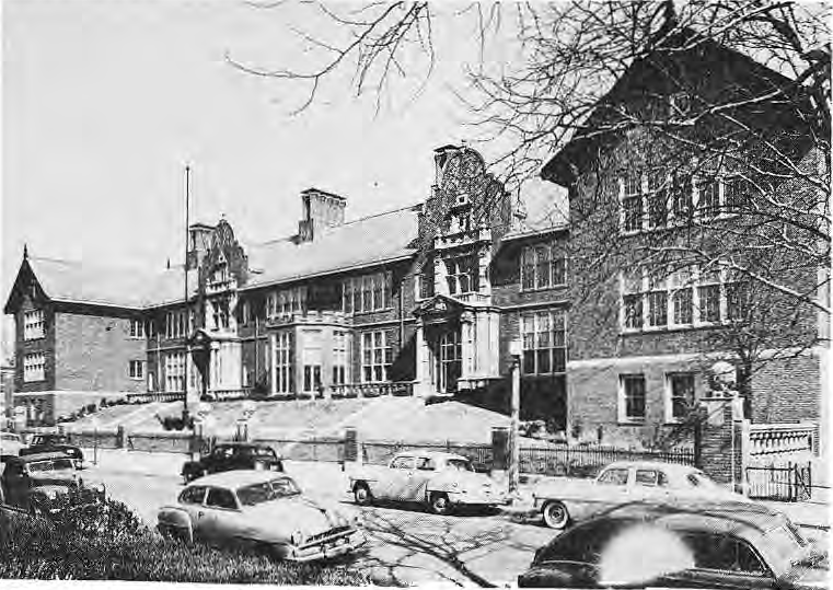 Original photograph of Hamilton School with automobiles parked along the street.