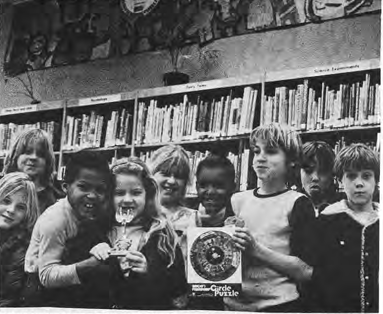 Neighborhood School delegation with its mural contest trophy. Printed caption names retained without guessing left-to-right positions.