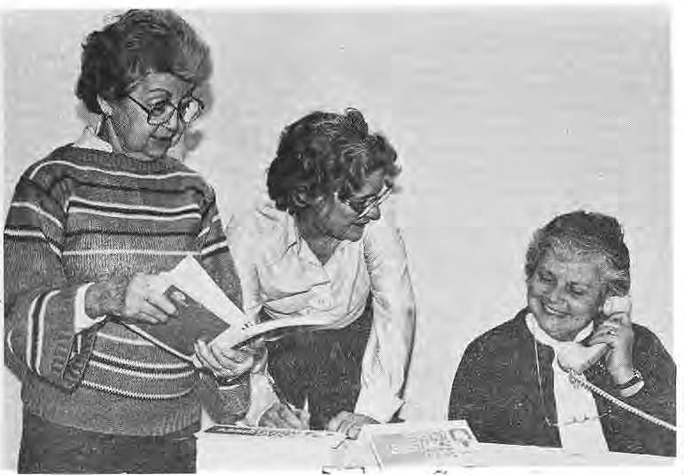 Rita Magyar, Anne Morris, and Mary Watkins working together at the Community Action Office.