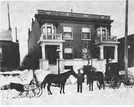 Horse-drawn mail wagon in snow, circa1915.