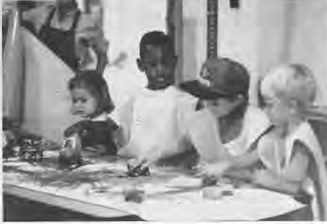 St. Roch preschool children at work. Photographer not credited.