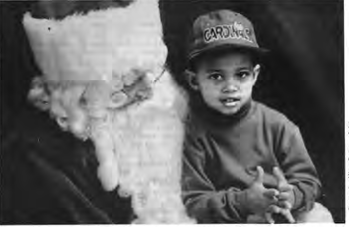 Joshua Armstrong meets Santa at SDCC,December1994. Photo by King Schoenfeld.