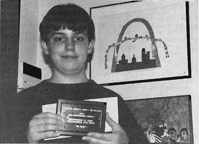 Jeff Schoenfeld with poster competition award. Photographer not credited.