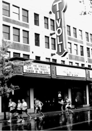 Marathon runners pass Tivoli Theatre in original source illustration. Photographer not credited.