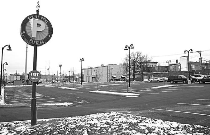 Free parking behind former funeral home and Pin-Up Bowl; source reports168spaces.