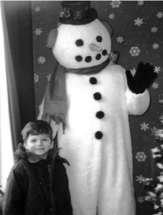 Evan Jacobs with Frosty at Blueberry Hill at the Loop Holiday Walk.