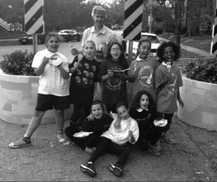 Andy Cross assisted Girl Scouts with painting planters.