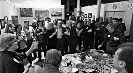 Capacity crowd at Cross Art Studio celebrated winter and raised more than 1000 dollars for the TIMES, as printed caption states.