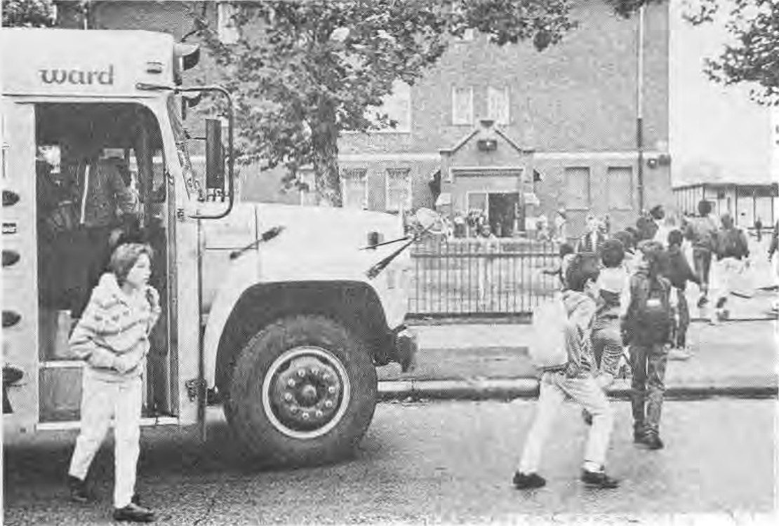 Children arriving by school bus at Hamilton Elementary School in November 1988.