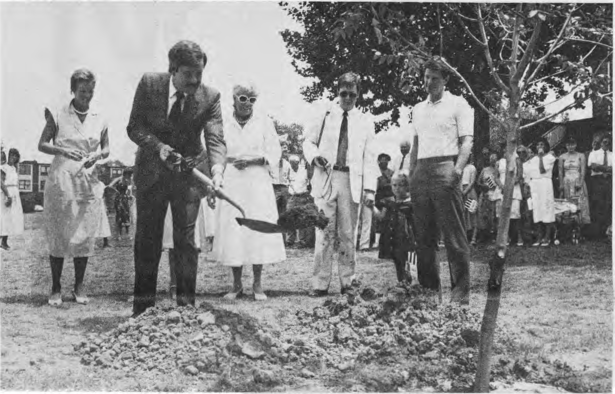 Members of the Lucier family planting a memorial tree with Mayor Schoemehl.