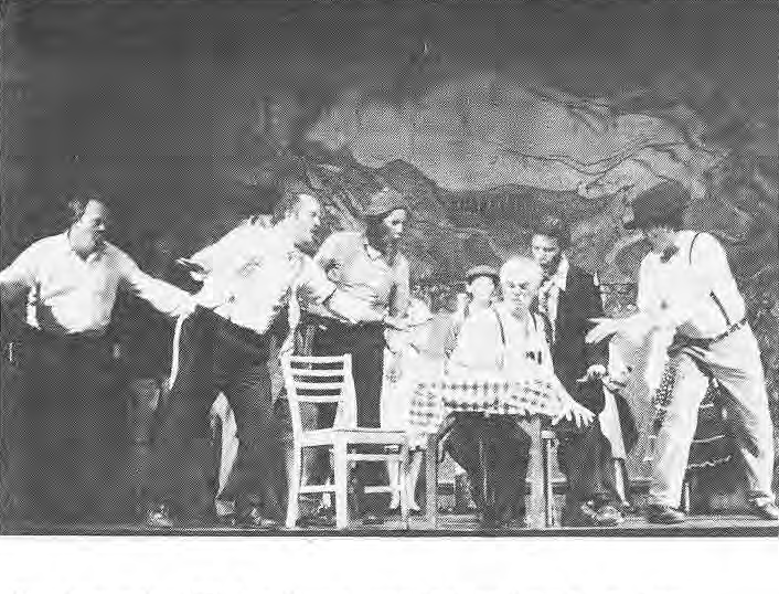 The bartender (Ed Stout) and assorted wastrels try to convince Joe to go home.