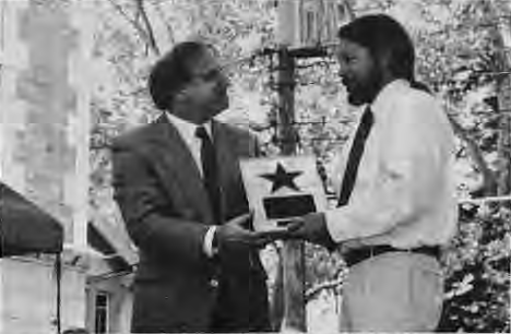 Joe Edwards(right)presents a Walk of Fame Star to Leonard Slatkin.