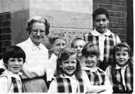 Sister Leo Ann Bubb with several students on the St. Roch School grounds. Photo by King Schoenfeld.