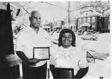 Victor Saunders(left), current 5700 Waterman block captain, and Charlotte Simpson, past block captain, display their Urban League Block Beautification Award. Photo by King Schoenfeld.