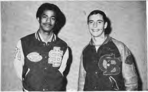 The two neighborhood football champions, Earl Patterson and Tim Cantwell, wearing letter jackets.