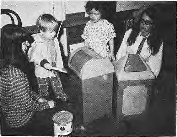 Children playing with large cardboard structures inside the newly opened Treehouse center.