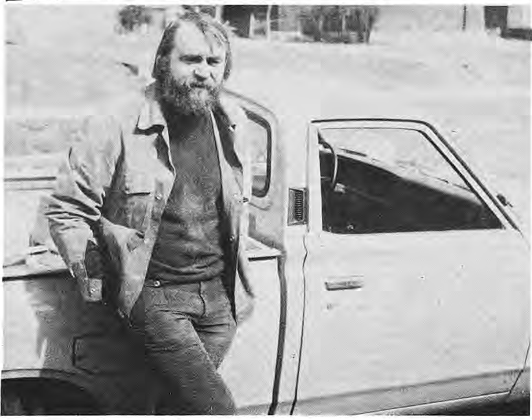 Original photograph of Joe Mensing beside a car.