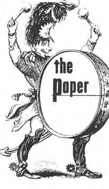 Original drummer carrying a drum labelled The Paper.