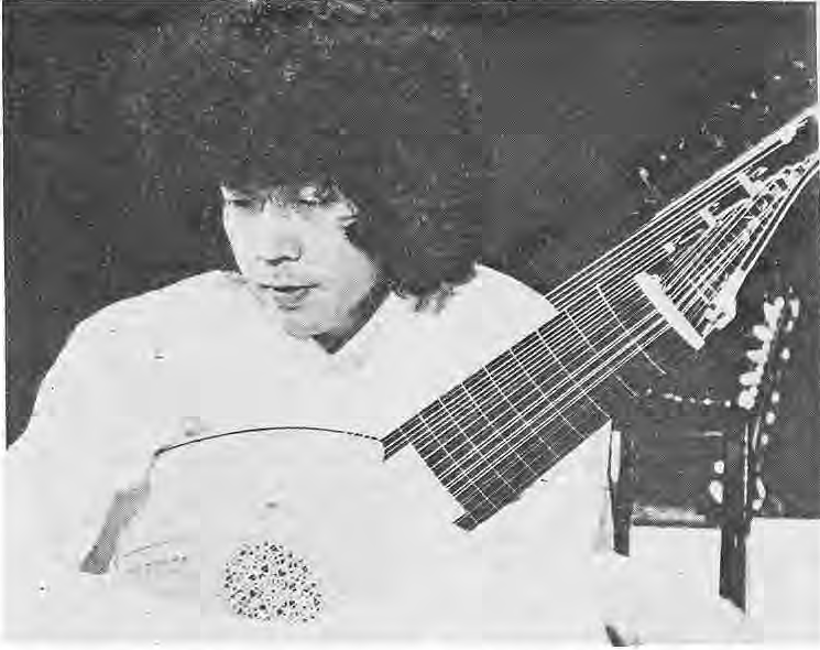 Lutist Toyohiko Satoh holding a lute.
