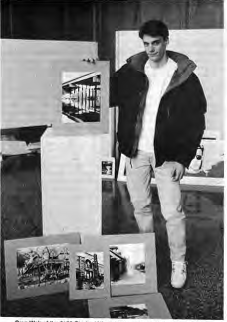 Greg Weir with his award-winning photographic portfolio.