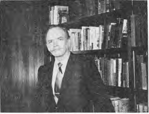 Rev. Robert Gordon, identified by the printed photograph caption, seated beside bookshelves.