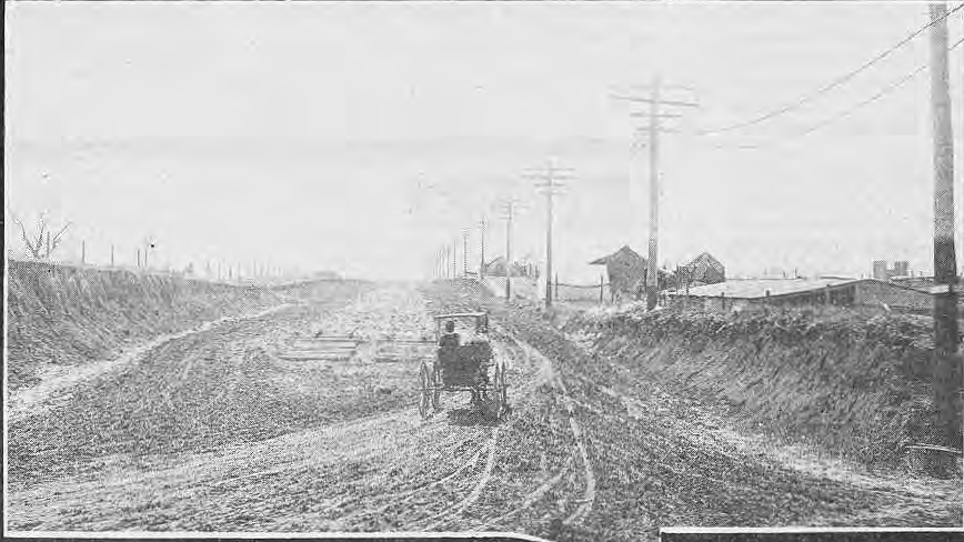 Original historical view of muddy Skinker roadway and distant Brookings Hall.