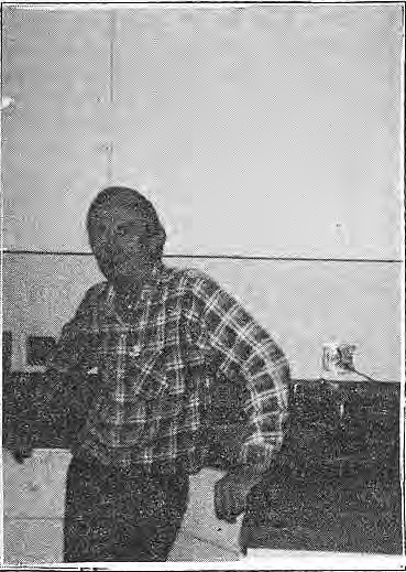 Original neighborhood photograph accompanying Vicissitudes; The now familiar sight of a renovator in action..