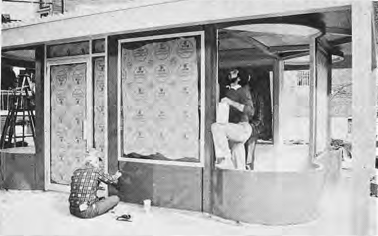Workers assembling the new library kiosk at Kingsbury and Des Peres.